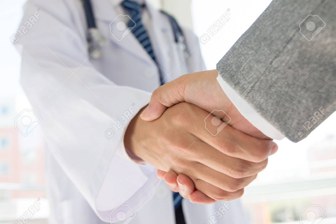 doctor and businessman shaking hands stock photo picture and