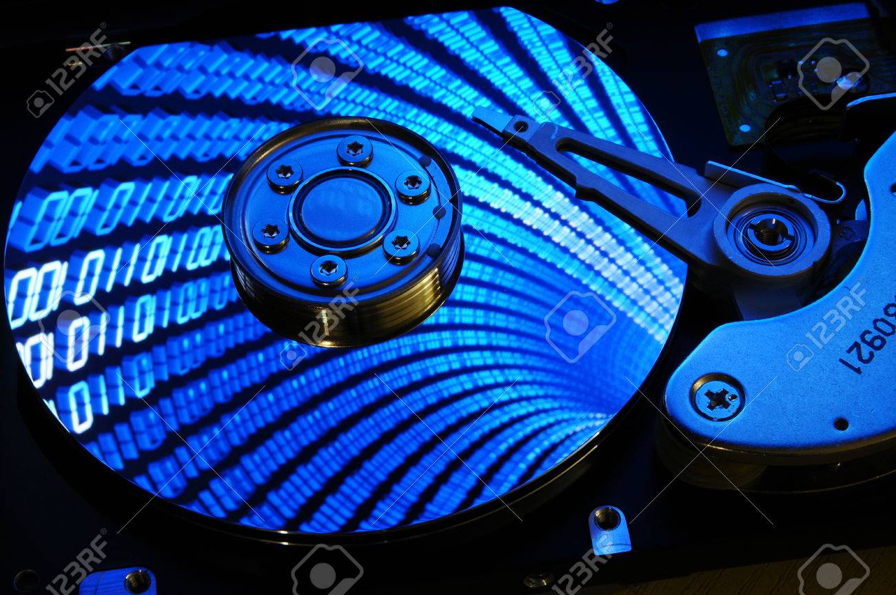 Close Up Of Computer Hard Drive Disc With Binary Effects Reflected On The  Disk Surface. Background Wallpaper. Stock Photo, Picture And Royalty Free  Image. Image 69558205.