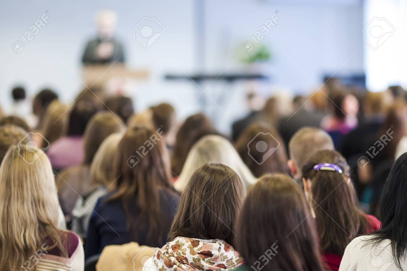 Male Lecturer Speaking In Front of the Audience During The Conference. Horizontal Image Composition - 156346326 Male Lecturer Speaking In Front of the Audience During The Conference. Horizontal Image Composition - 156346326