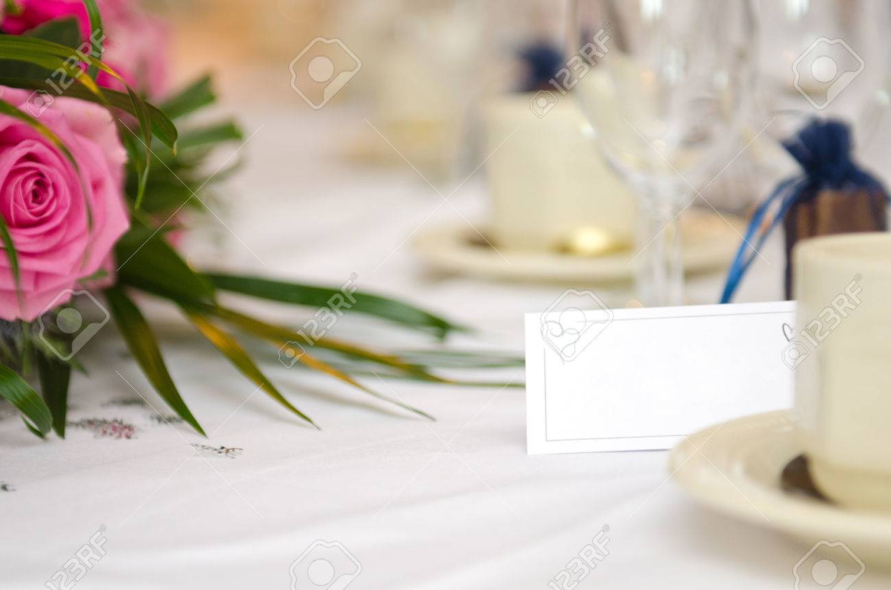 an empty blank paper table card name plate sign on a wedding stock
