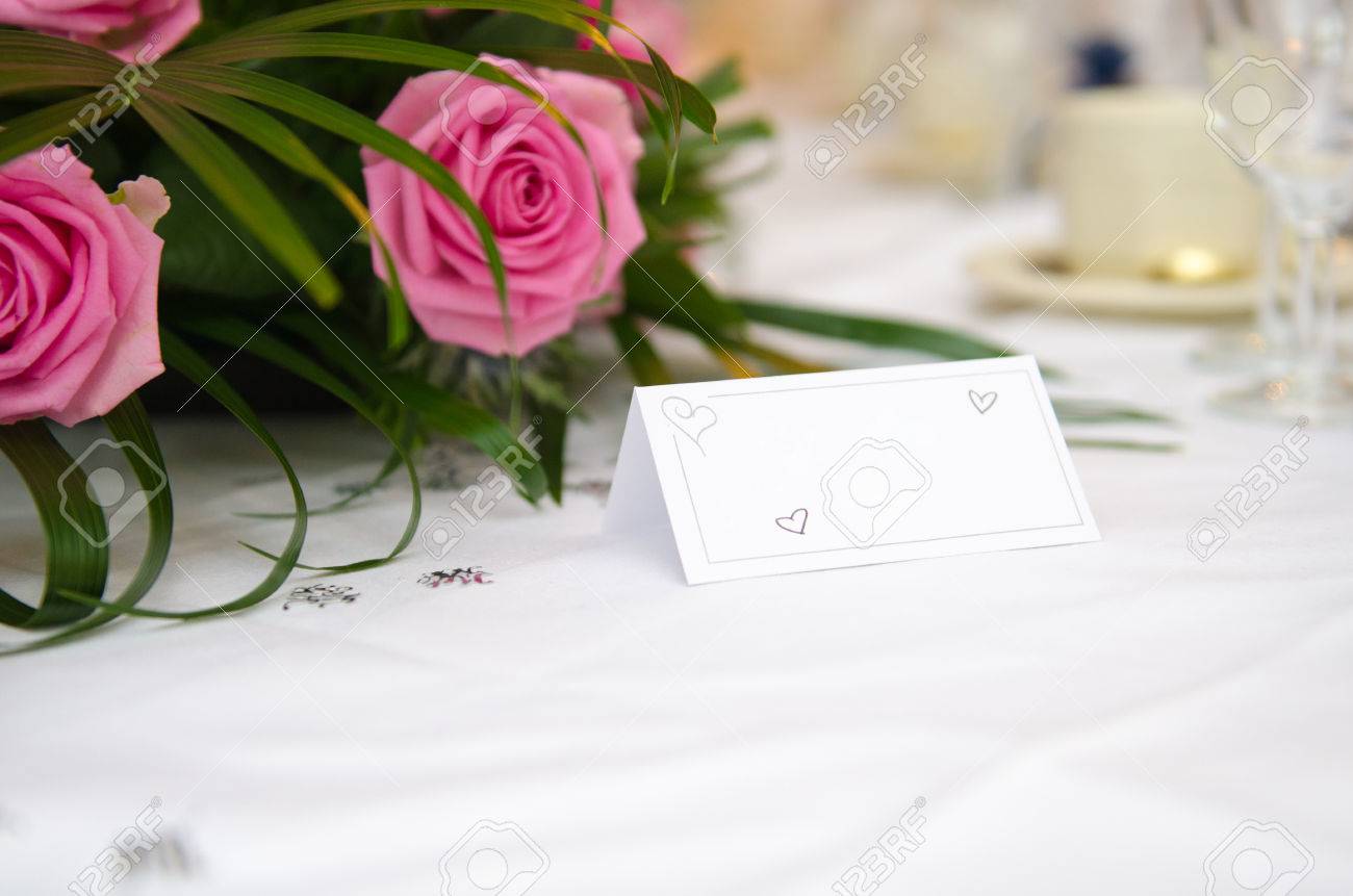 an empty blank paper table card name plate sign on a wedding stock