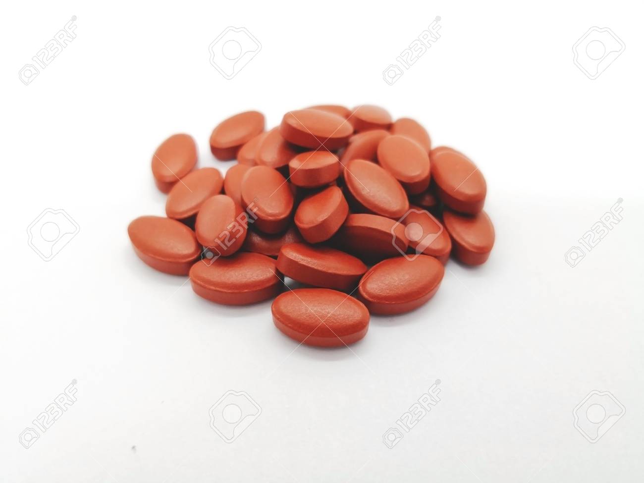 Medication and healthcare concept. Many oval brown tablets of Ferrous sulfate 300 mg. with other vitamin, isolated on white background, use for Iron Deficiency Anemia. focus on foreground and copy space. - 94228364 Medication and healthcare concept. Many oval brown tablets of Ferrous sulfate 300 mg. with other vitamin, isolated on white background, use for Iron Deficiency Anemia. focus on foreground and copy space. - 94228364