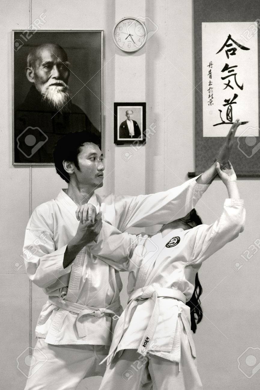 PHUKET TOWN, PHUKET, THAILAND, 3 MARCH 2014: Students of Aikido perform techniques on the mat during a promotion test. - 31155655 PHUKET TOWN, PHUKET, THAILAND, 3 MARCH 2014: Students of Aikido perform techniques on the mat during a promotion test. - 31155655
