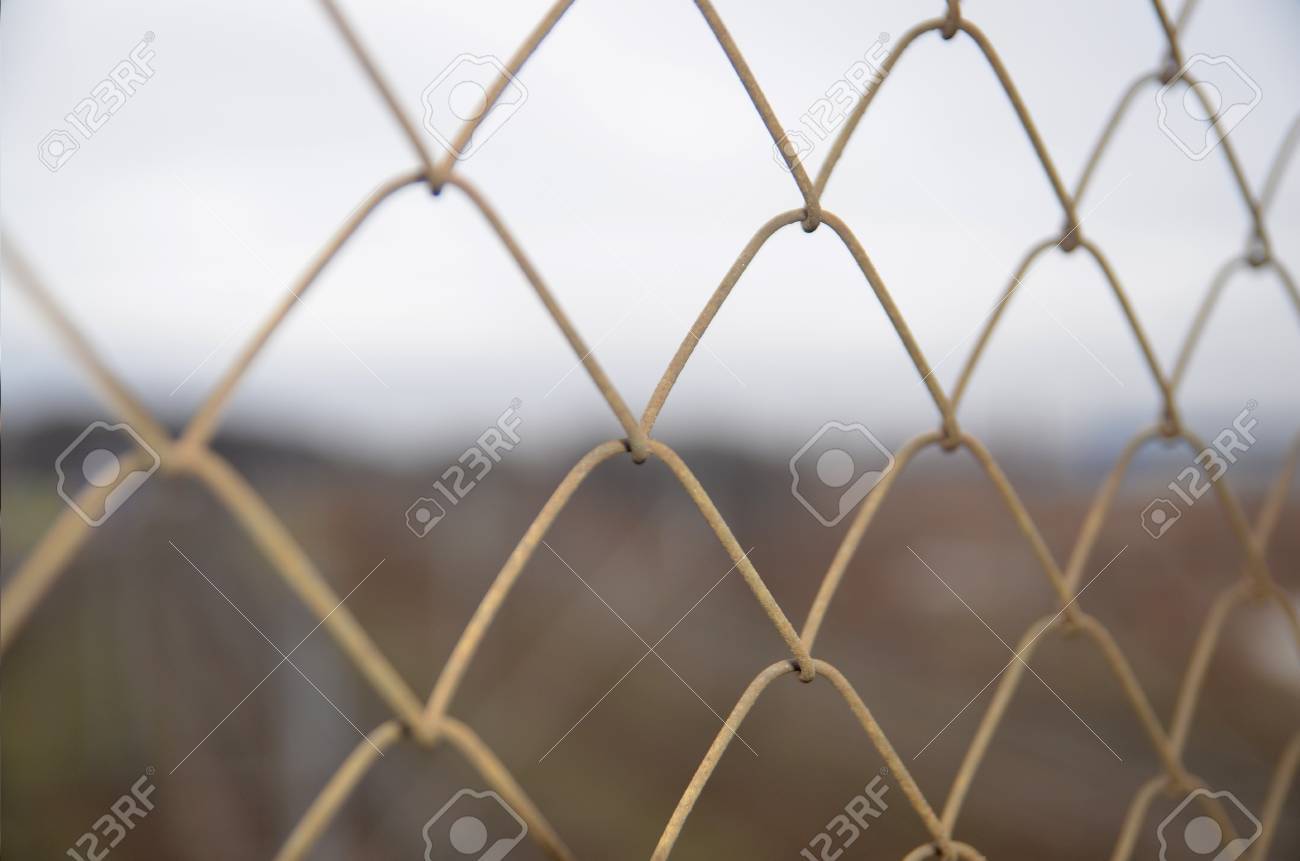 chain link grid fence close view prison concept stock photo