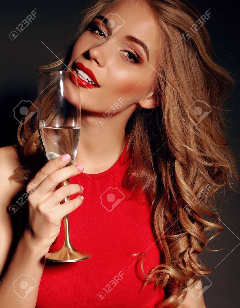 Party Photo Of Sexy Lady In Red Dress With Red Lips And Blond Beautiful Curly Hair Party Photo Of Sexy Lady In Red Dress With Red Lips And Blond Beautiful Curly Hair