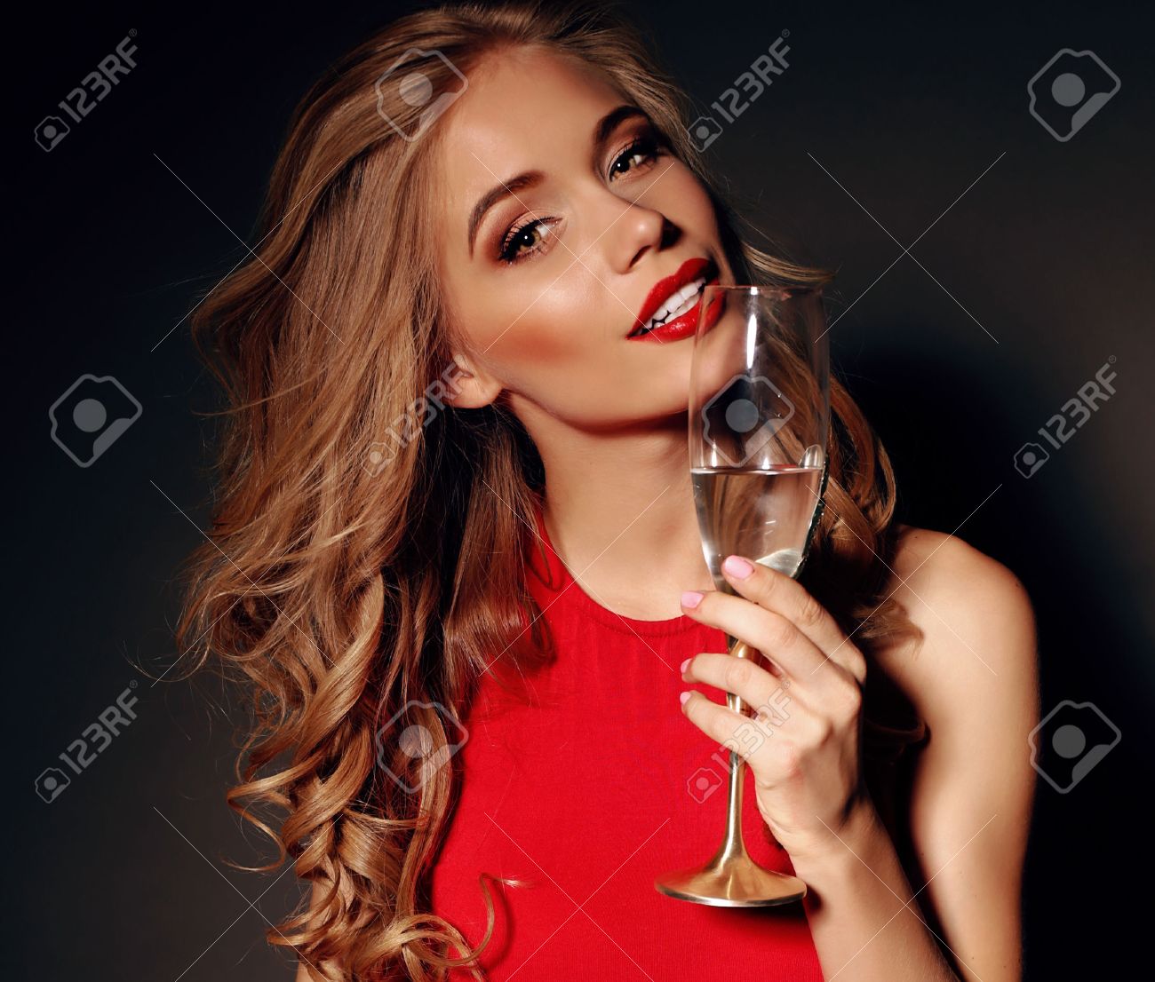 Party Photo Of Sexy Lady In Red Dress With Red Lips And Blond Beautiful Curly Hair Party Photo Of Sexy Lady In Red Dress With Red Lips And Blond Beautiful Curly Hair