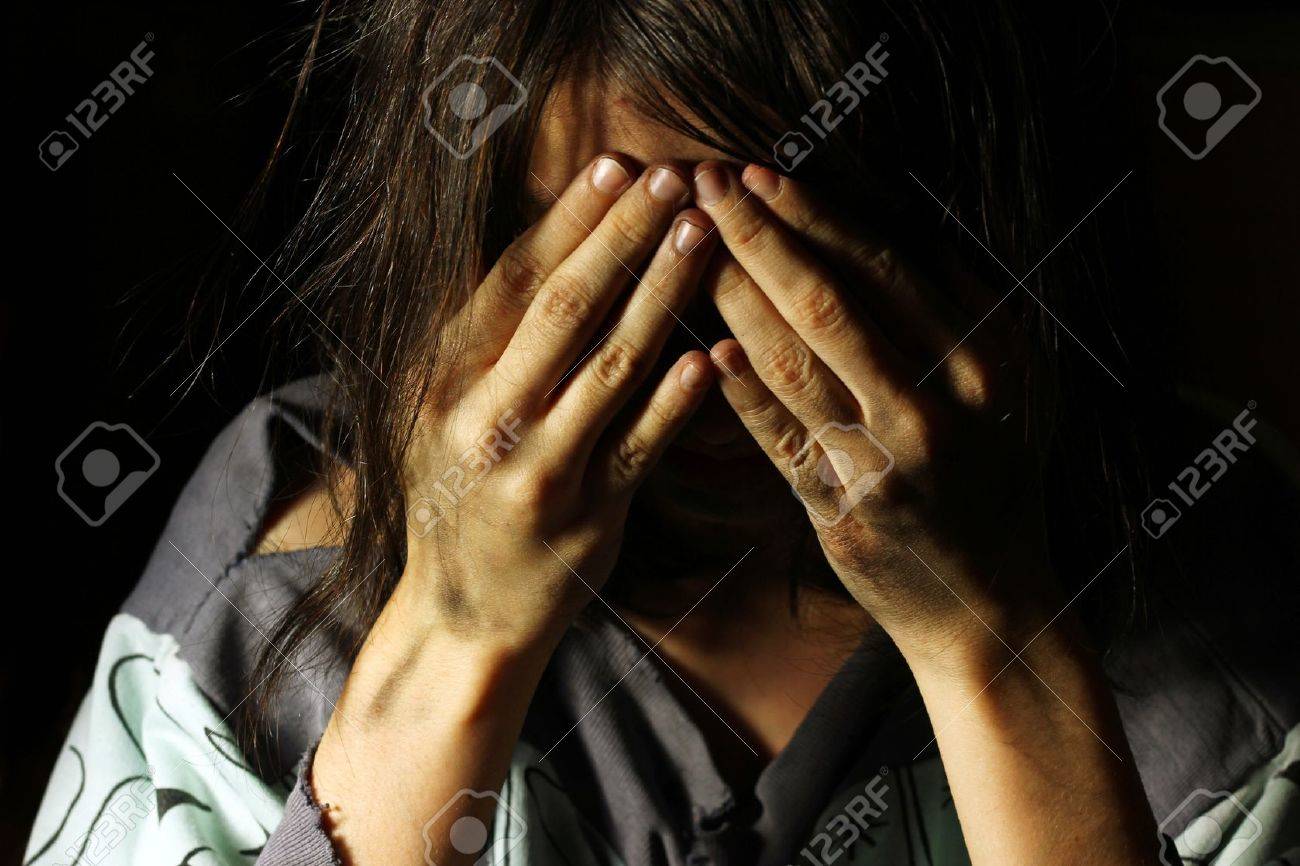 Poor dirty girl crying with hands on her face - 18348685 Poor dirty girl crying with hands on her face - 18348685