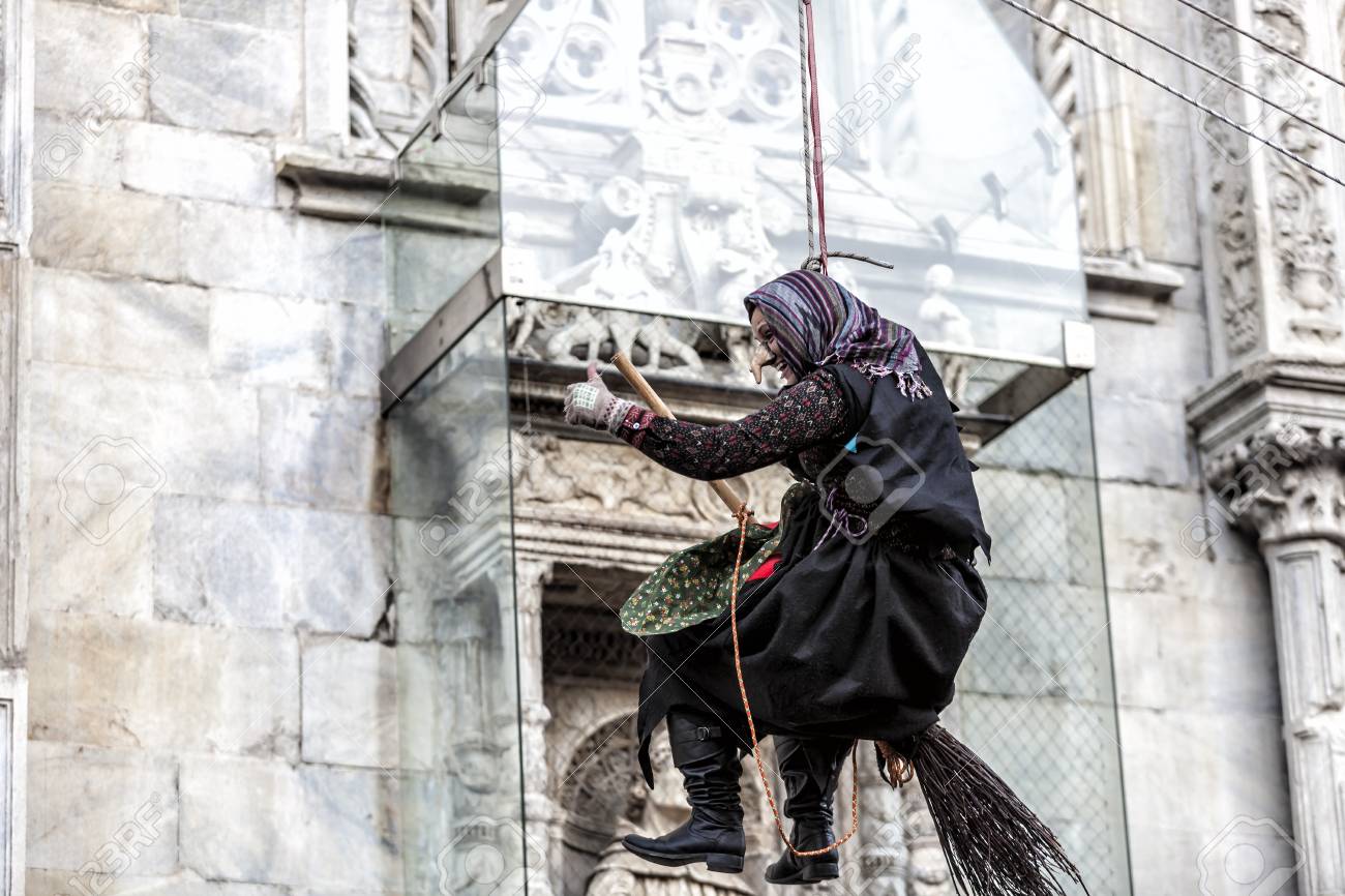 COMO, ITALY - January 6, 2017: during Epiphany an old woman flies bringing sweets to good children and coal to bad ones. Como Lake - 97261678 COMO, ITALY - January 6, 2017: during Epiphany an old woman flies bringing sweets to good children and coal to bad ones. Como Lake - 97261678