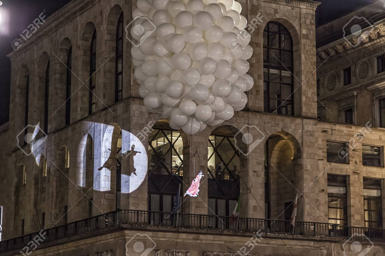 MILAN - ITALY - March 02, 2017: A company of acrobats actors inaugurate the Milan Carnival. In the background the Arengario Palace. Duomo Cathedral square, Milan, Lombardy, Italy - 97342043 MILAN - ITALY - March 02, 2017: A company of acrobats actors inaugurate the Milan Carnival. In the background the Arengario Palace. Duomo Cathedral square, Milan, Lombardy, Italy - 97342043