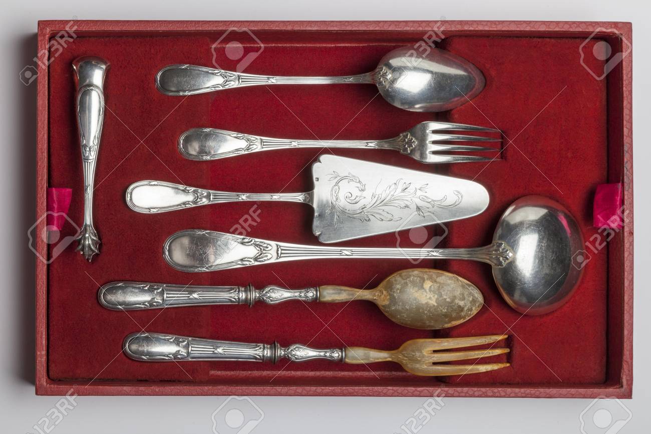 Vintage silverware in red velvet box isolated on white background, circa 1920 - 97253799 Vintage silverware in red velvet box isolated on white background, circa 1920 - 97253799