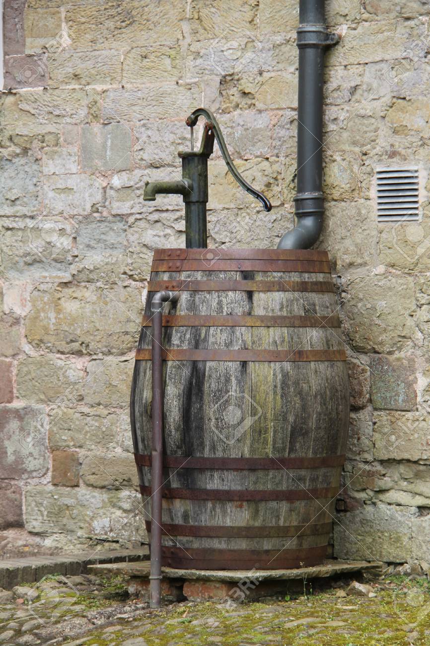 A Wooden Barrel Water Butt With A 