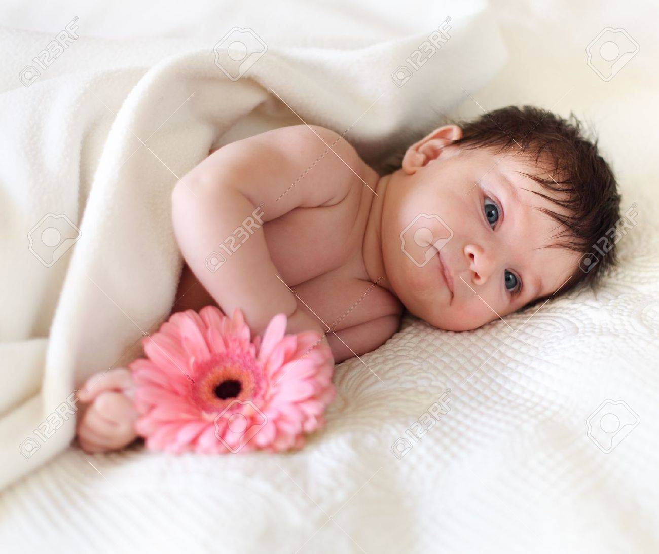 Portrait Of A Baby With Flower Lying On The Bed One Month Old Stock Photo Picture And Royalty Free Image Image