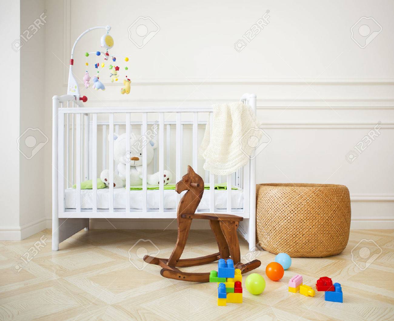 Empty nursery room with basket, toys and wooden horse - 31637897 Empty nursery room with basket, toys and wooden horse - 31637897