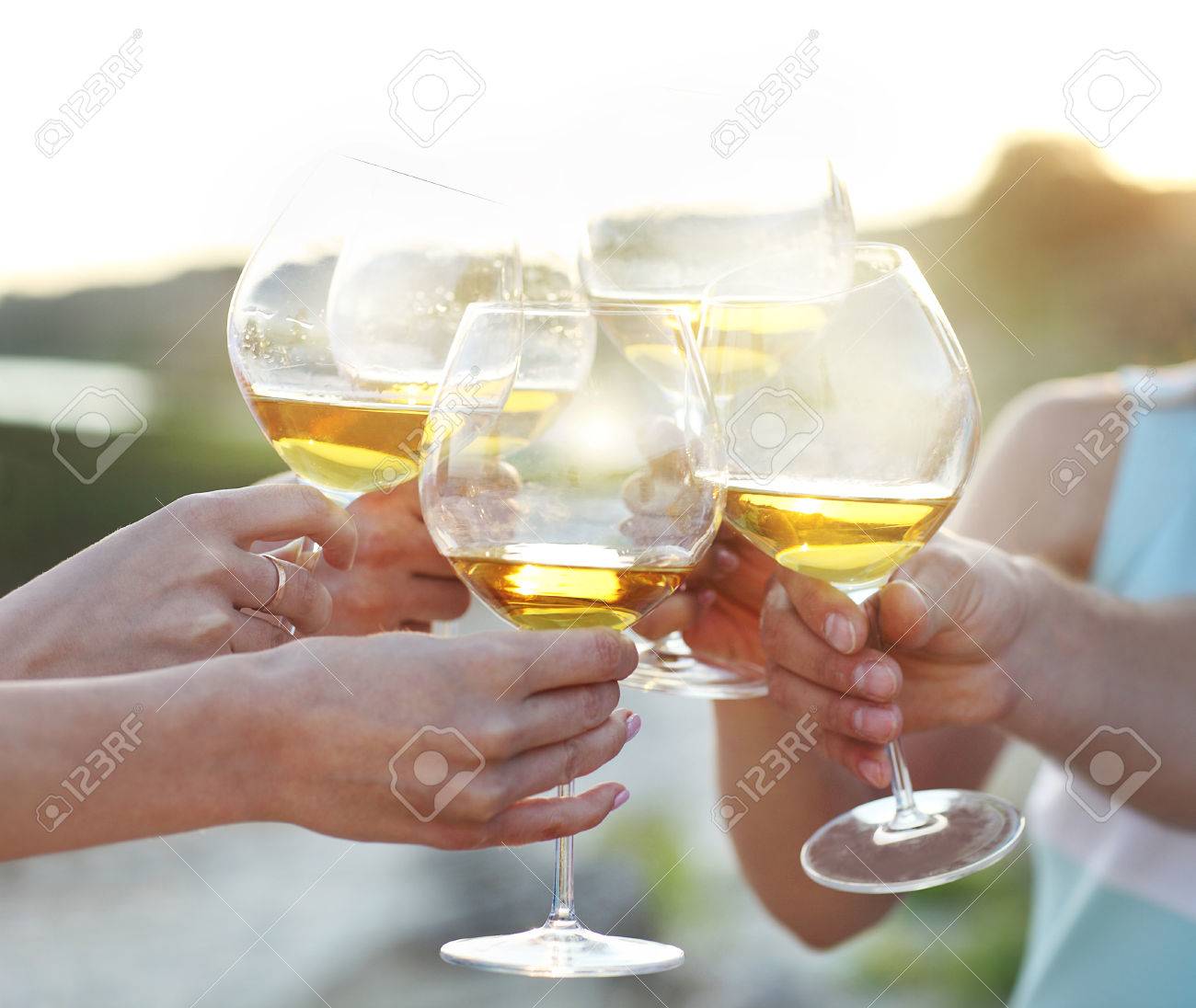 Celebration. People holding glasses of red wine making a toast - 43555333 Celebration. People holding glasses of red wine making a toast - 43555333