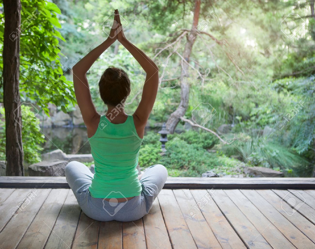 Young woman doing yoga asana in the evening outdoors - 43872835 Young woman doing yoga asana in the evening outdoors - 43872835