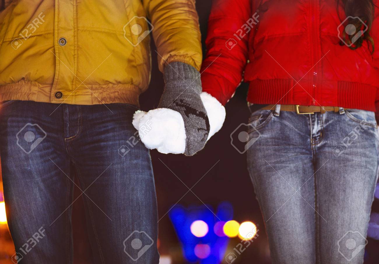 Happy couple holding hands in knitted mittens. Close up - 47219349 Happy couple holding hands in knitted mittens. Close up - 47219349