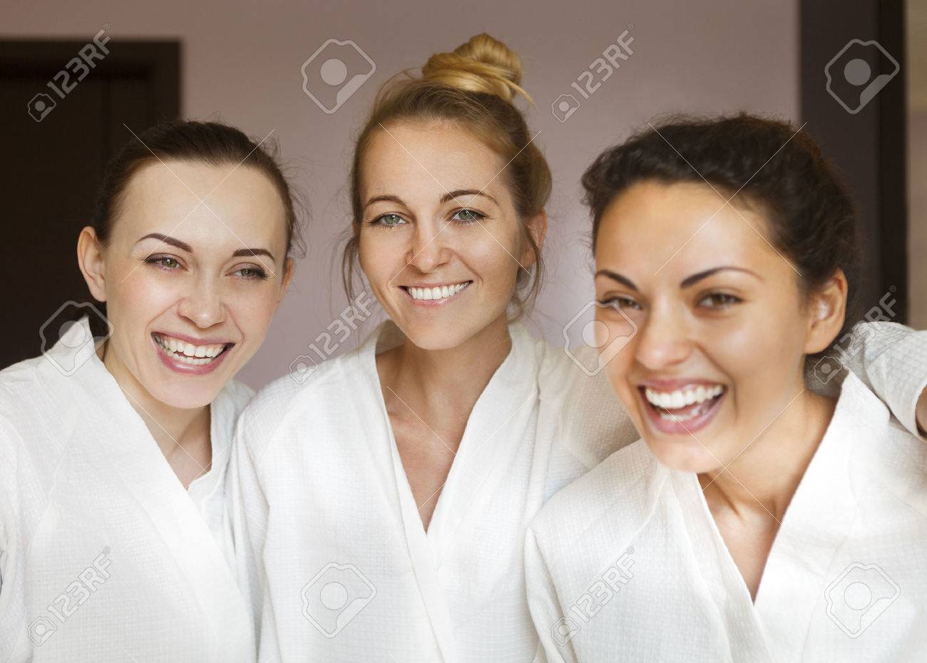 Three young happy women at spa resort. Frenship and wellbeing concept - 47707826 Three young happy women at spa resort. Frenship and wellbeing concept - 47707826