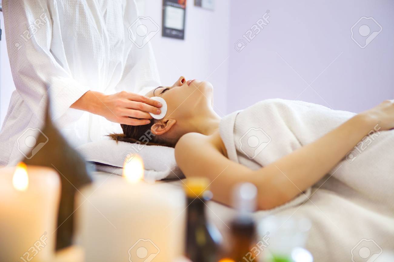 Relaxed woman with a deep cleansing nourishing face mask applied to her face. Spa treatment - 48212991 Relaxed woman with a deep cleansing nourishing face mask applied to her face. Spa treatment - 48212991