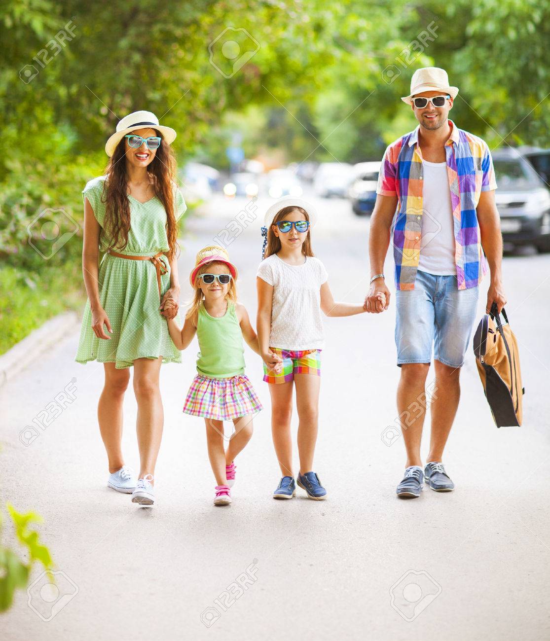 Happy young family walking with guitar spending carefree time together. Travel and holiday concept - 53770050 Happy young family walking with guitar spending carefree time together. Travel and holiday concept - 53770050