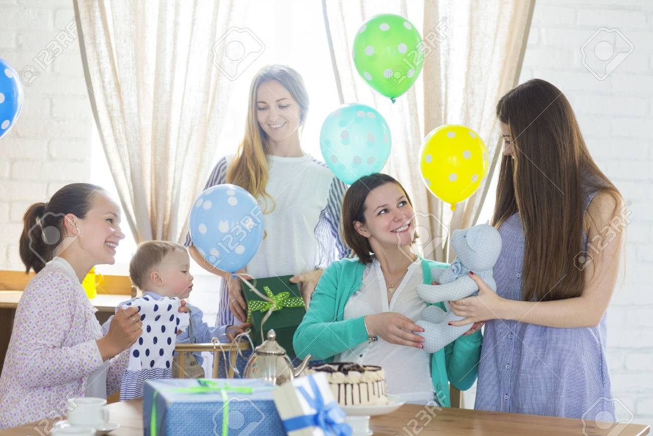 Portrait of pregnant woman with friends at a baby shower - 61042843 Portrait of pregnant woman with friends at a baby shower - 61042843