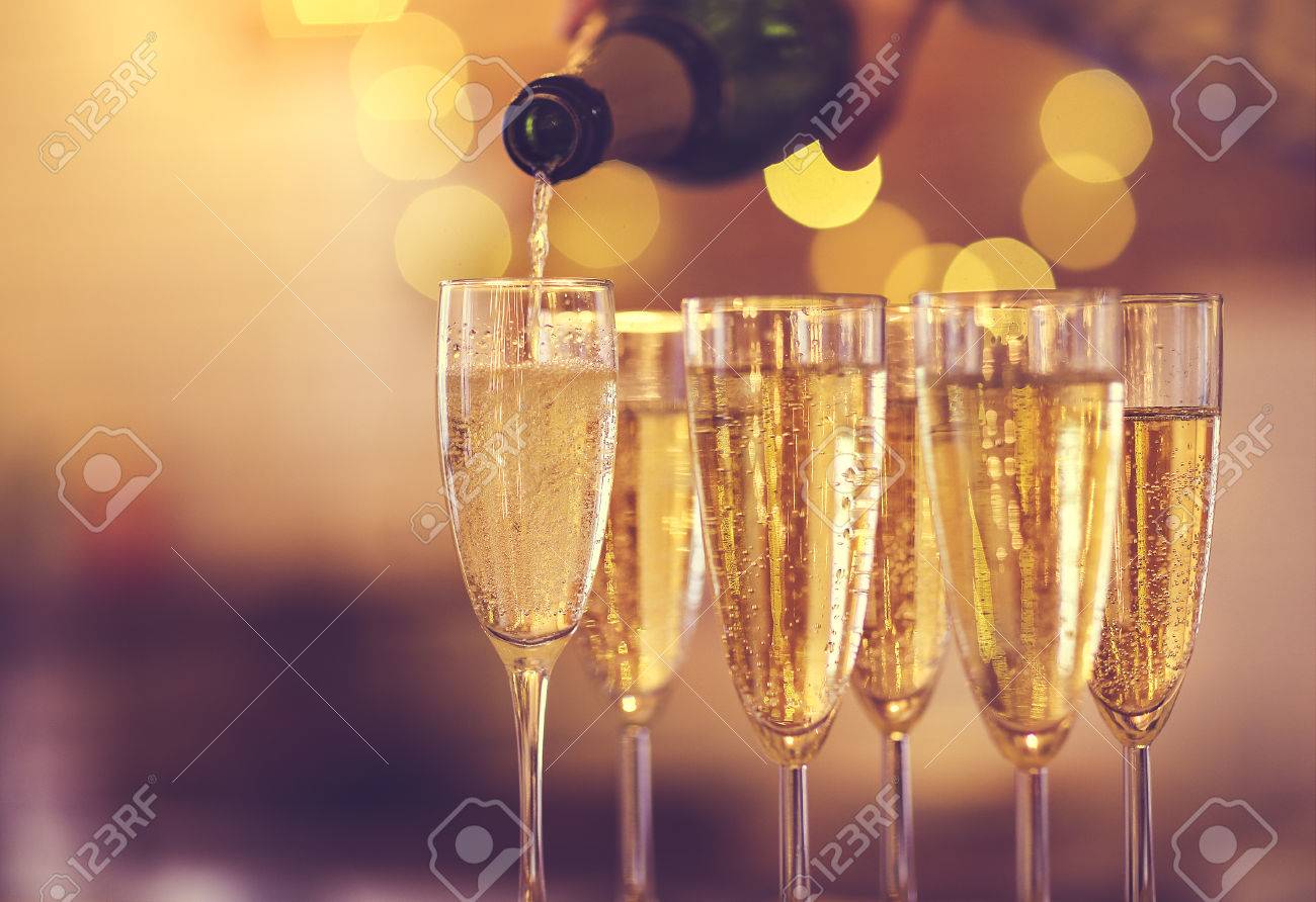 Champagne glasses on gold background. Party and holiday celebration concept - 84932416 Champagne glasses on gold background. Party and holiday celebration concept - 84932416