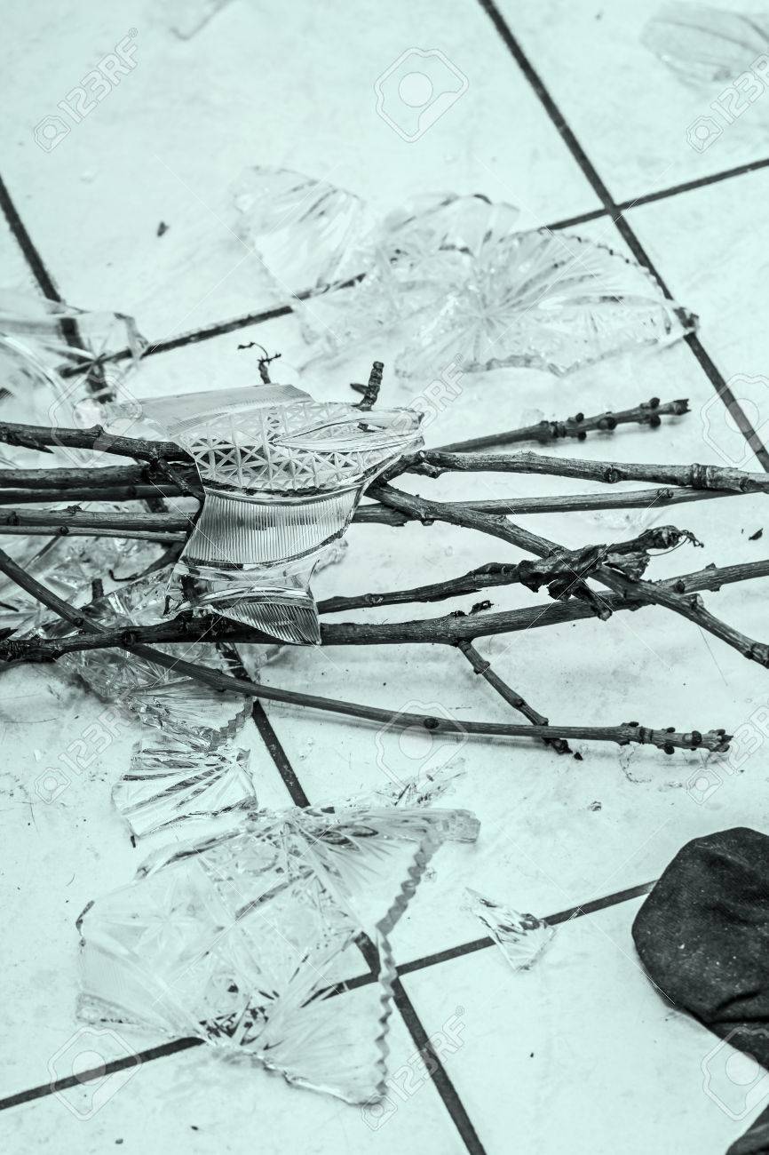 44228565-shards-of-broken-crystal-vase-on-floor.jpg