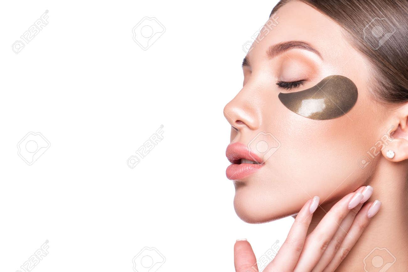 Beautiful model woman with collagen and hydrogel eye patch. - 165917990 Beautiful model woman with collagen and hydrogel eye patch. - 165917990