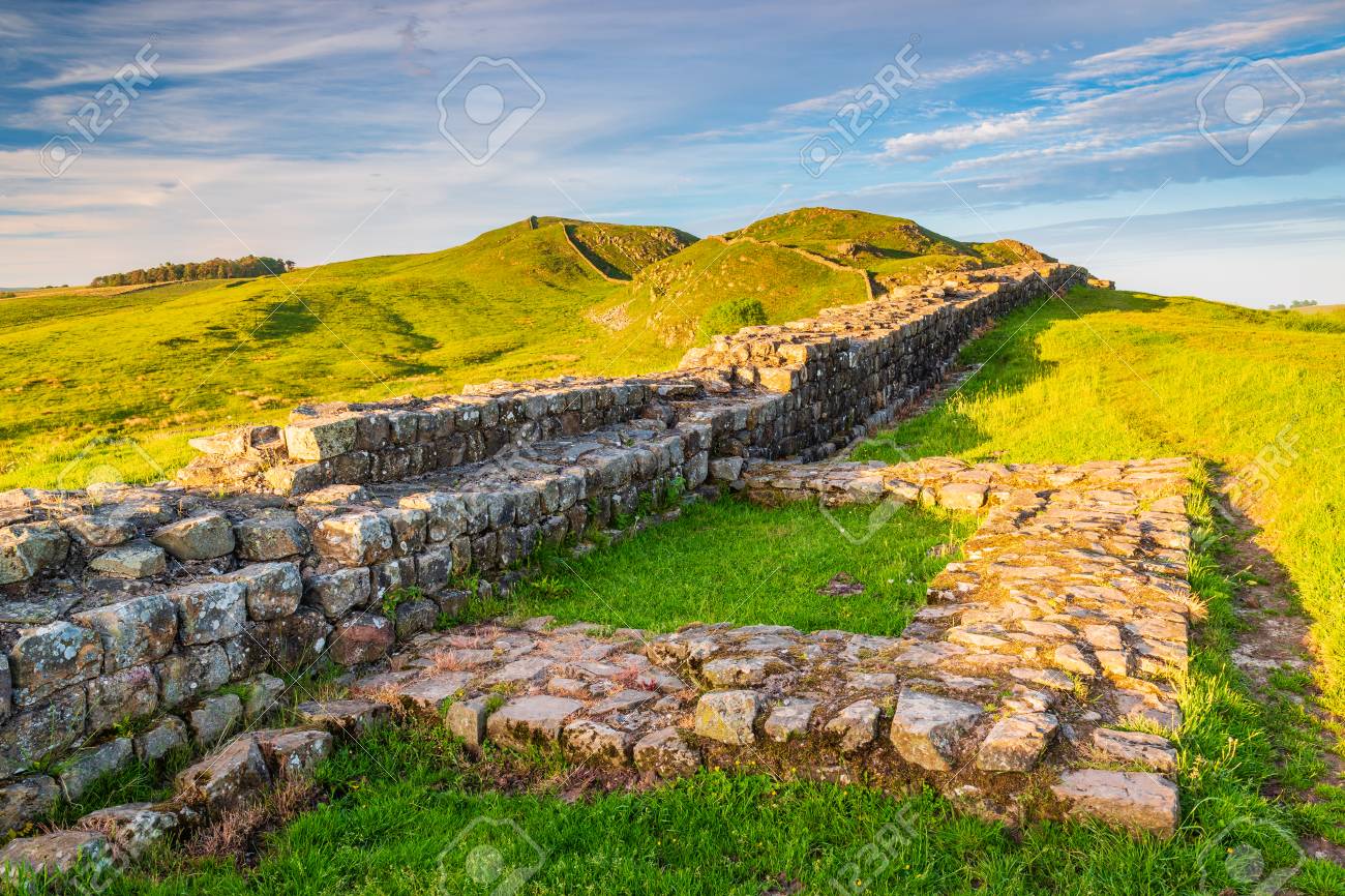 Golden Light at Hadrian's Wall Caw Gap in the beautiful Northumberland National Park. Popular with walkers along the Hadrian's Wall Path and Pennine Way - 103790763 Golden Light at Hadrian's Wall Caw Gap in the beautiful Northumberland National Park. Popular with walkers along the Hadrian's Wall Path and Pennine Way - 103790763