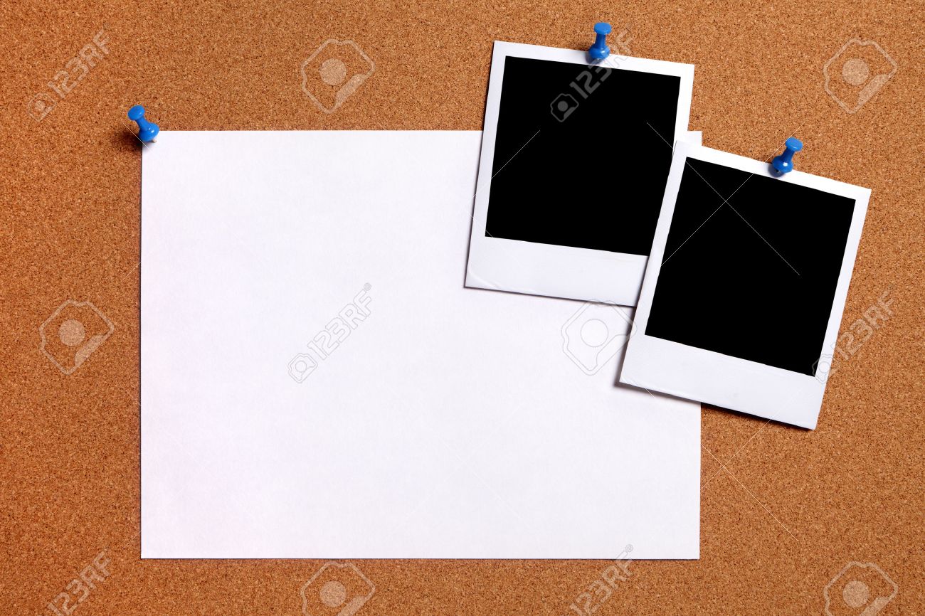 blank polaroid photo prints and plain paper poster pinned to stock