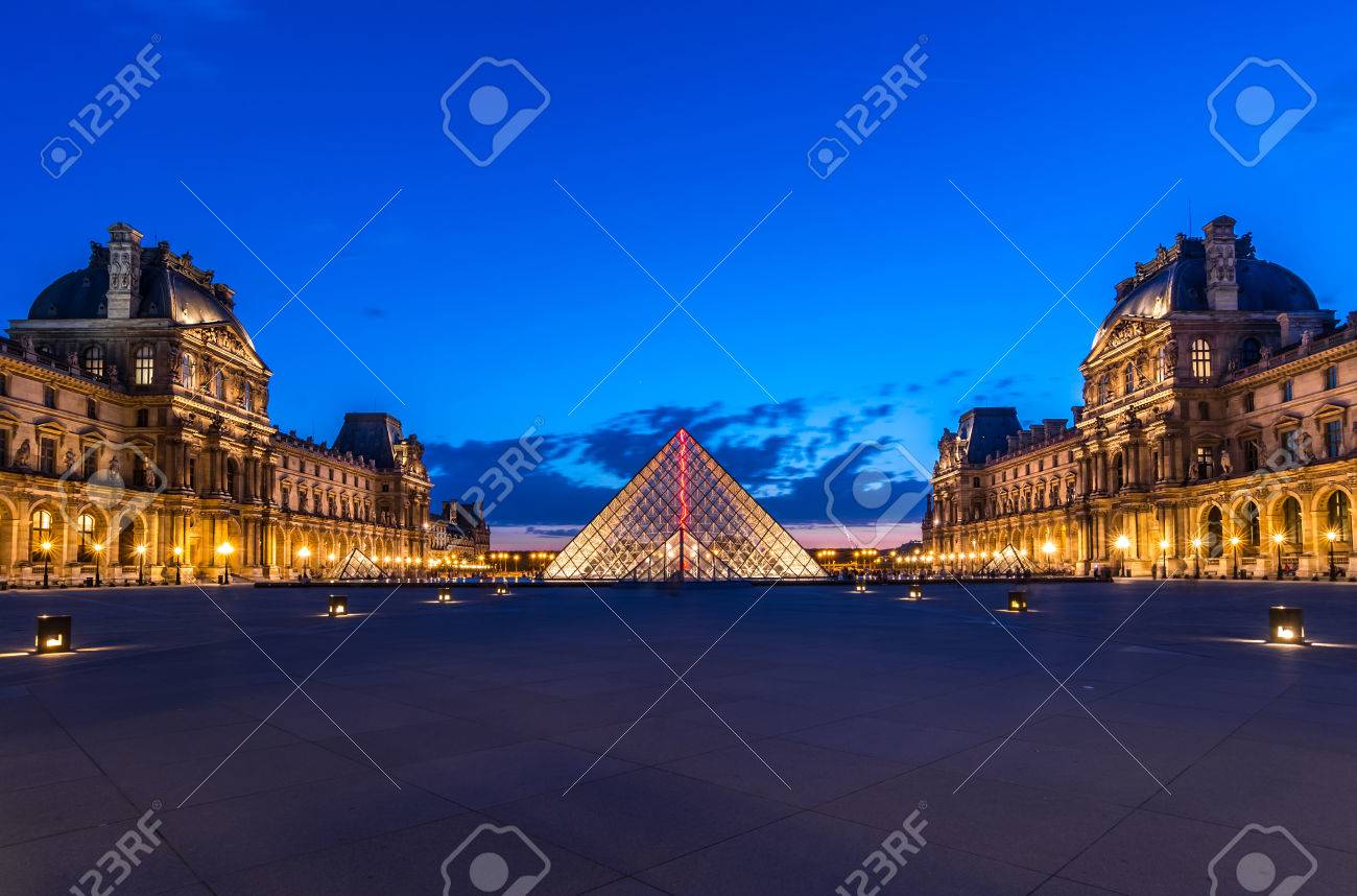 the louvre paris at twilight one of the major tourist attractions