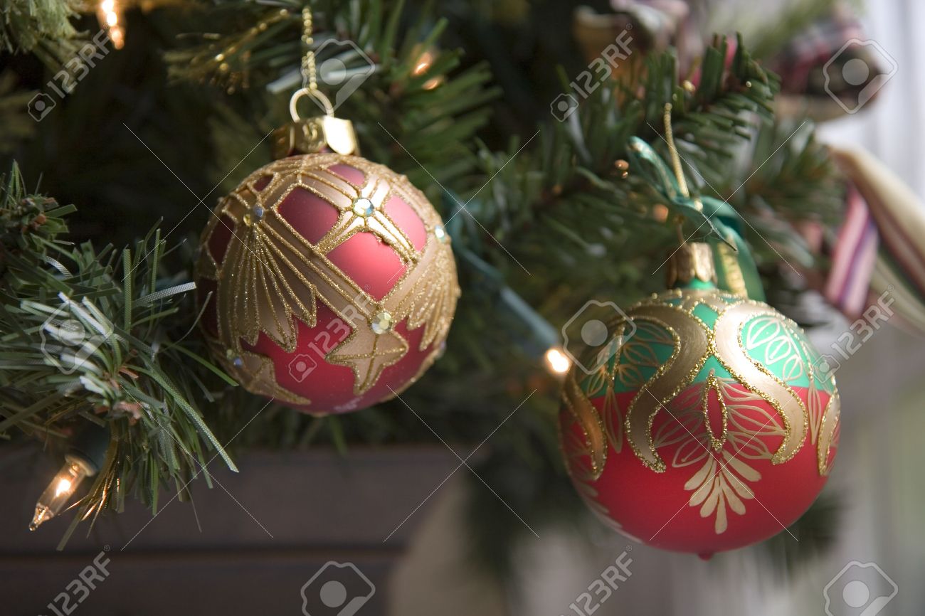 red green and gold ornaments on a custom christmas tree stock photo custom christmas tree ornaments