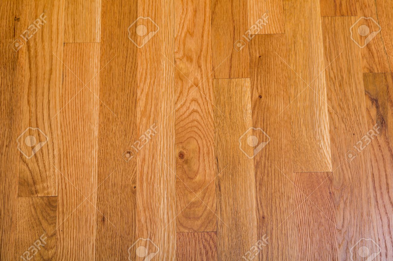 A Shiny Polished Hardwood Floor For Background Or Texture Stock Photo A Shiny Polished Hardwood Floor For Background Or Texture Stock Photo