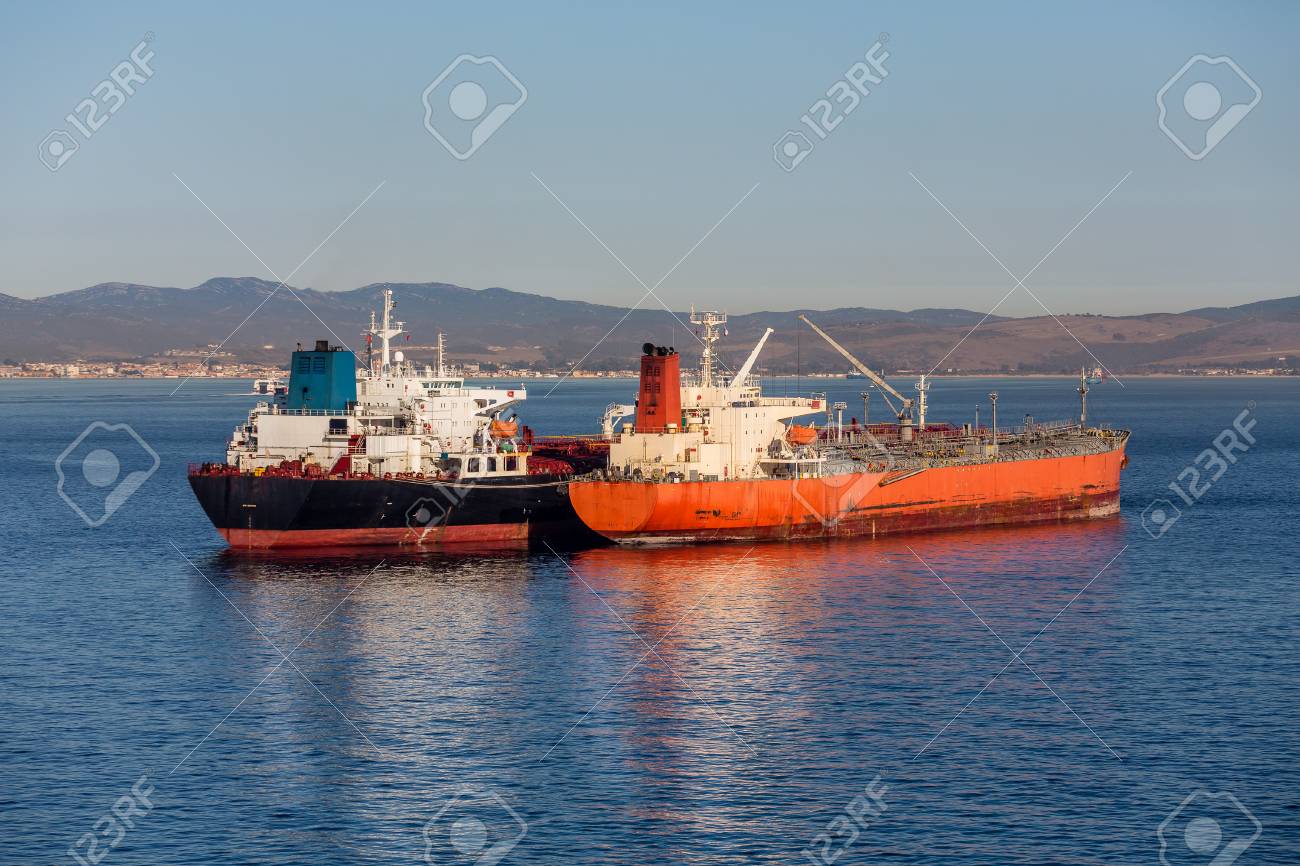 huge tankers in the harbor of gibralter between spain and morocco spain and morocco