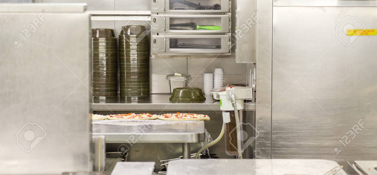 Pizza Prep Area In Commercial Kitchen On Stainless Steel Stock