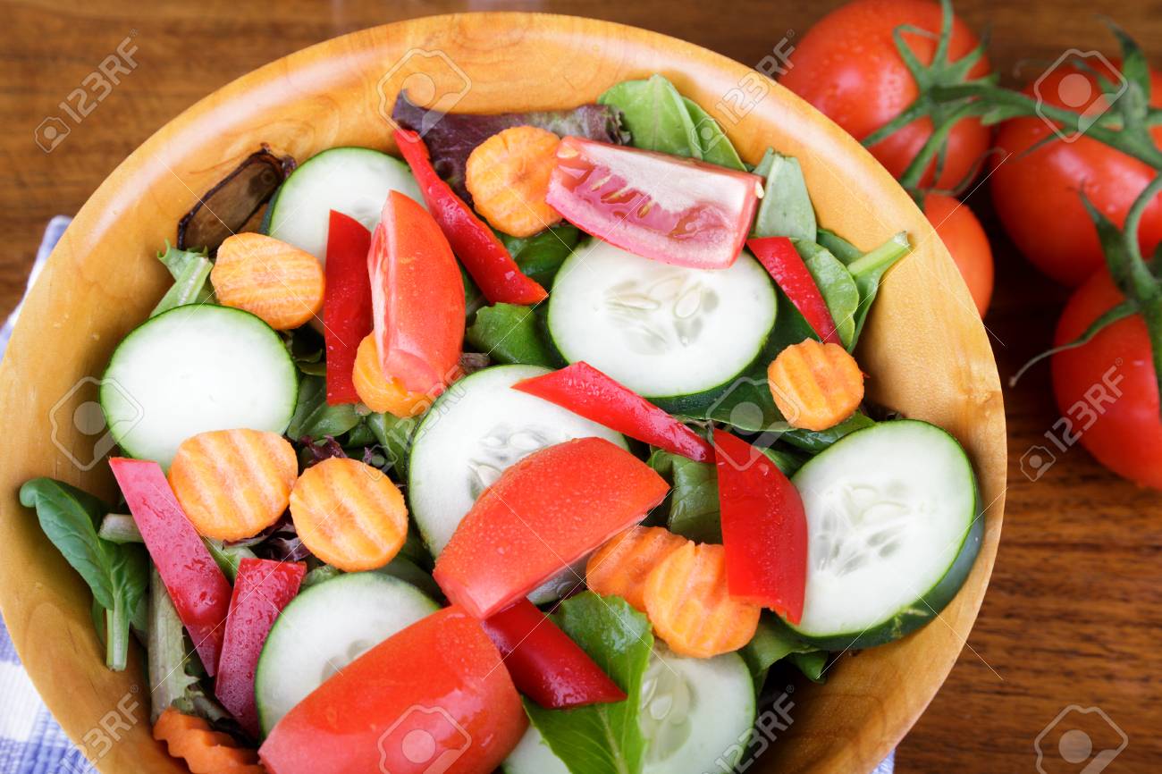 A Fresh Green Salad Of Lettuce Spinach Cucumbers Carrots Stock Photo Picture And Royalty Free Image Image 83022137