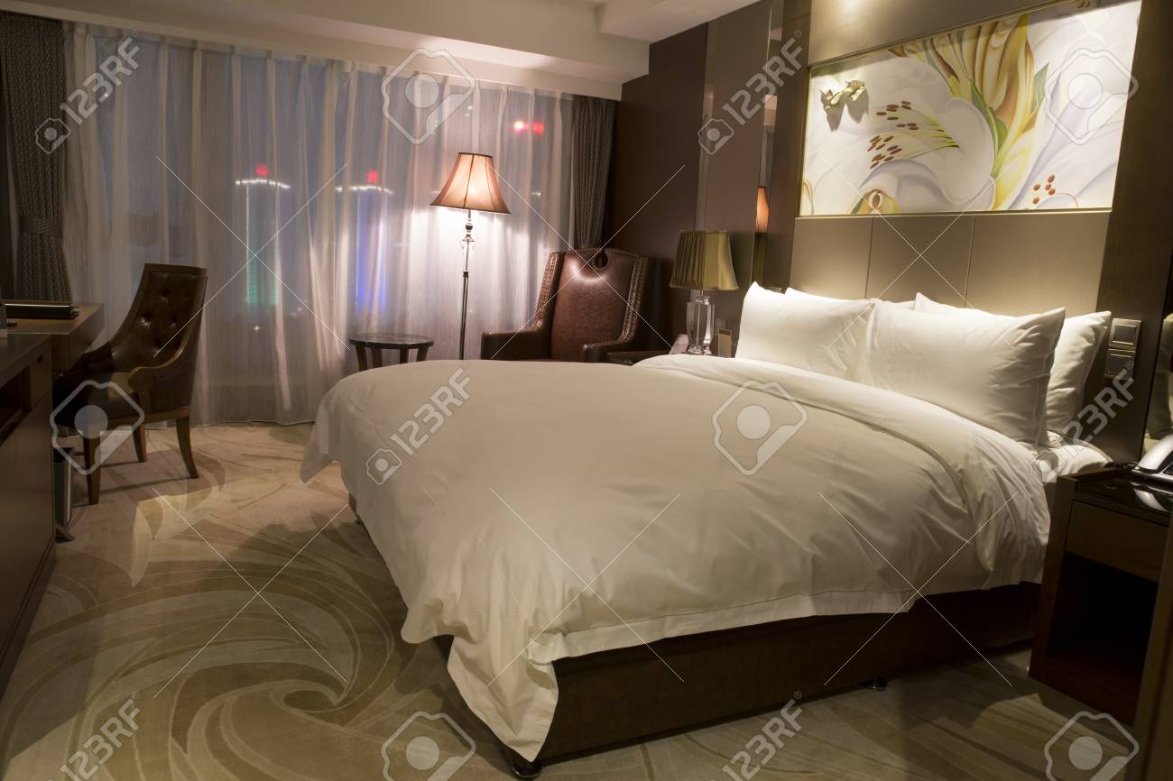 Modern Hotel Bedroom With Mood Lighting Lamps Art Hanging On