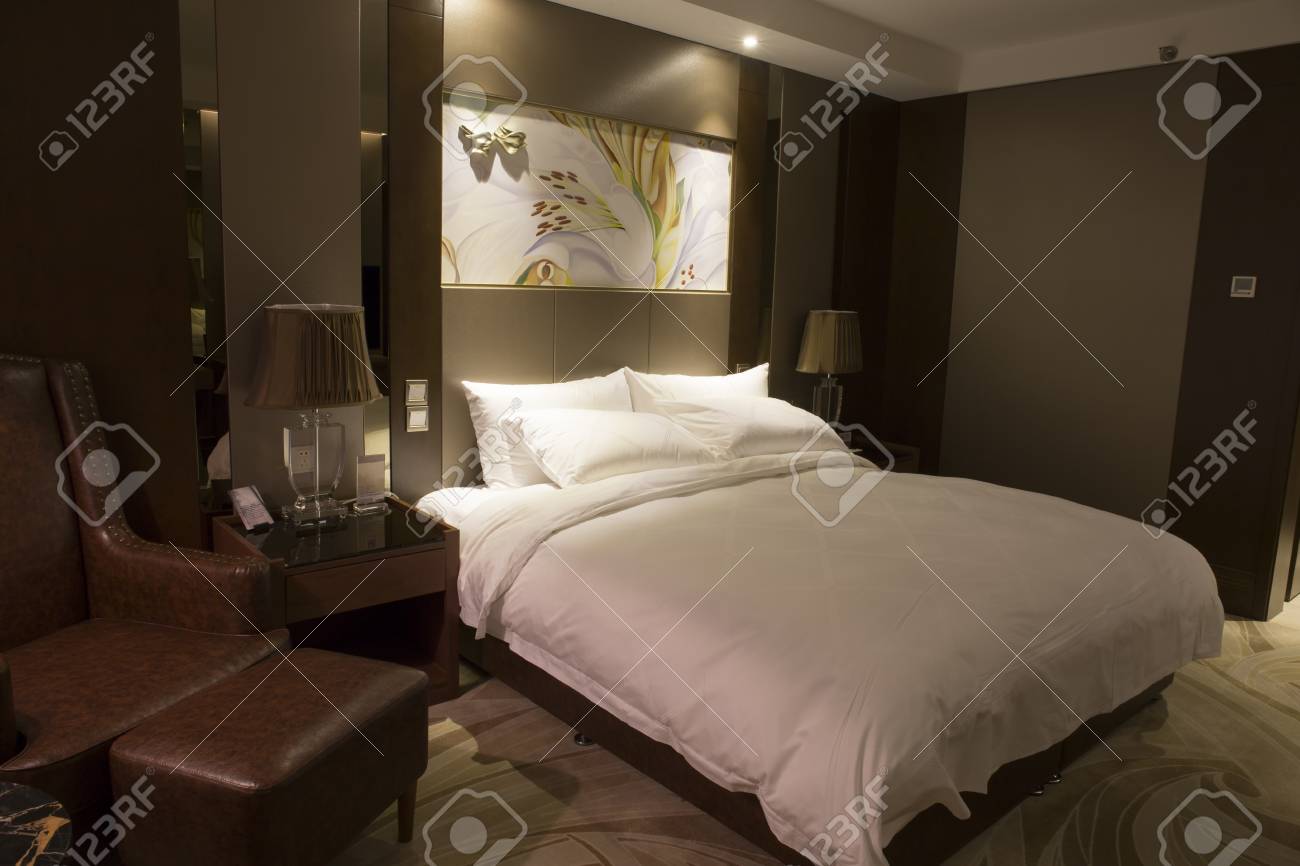 Modern Hotel Bedroom With Mood Lighting Lamps Art Hanging On