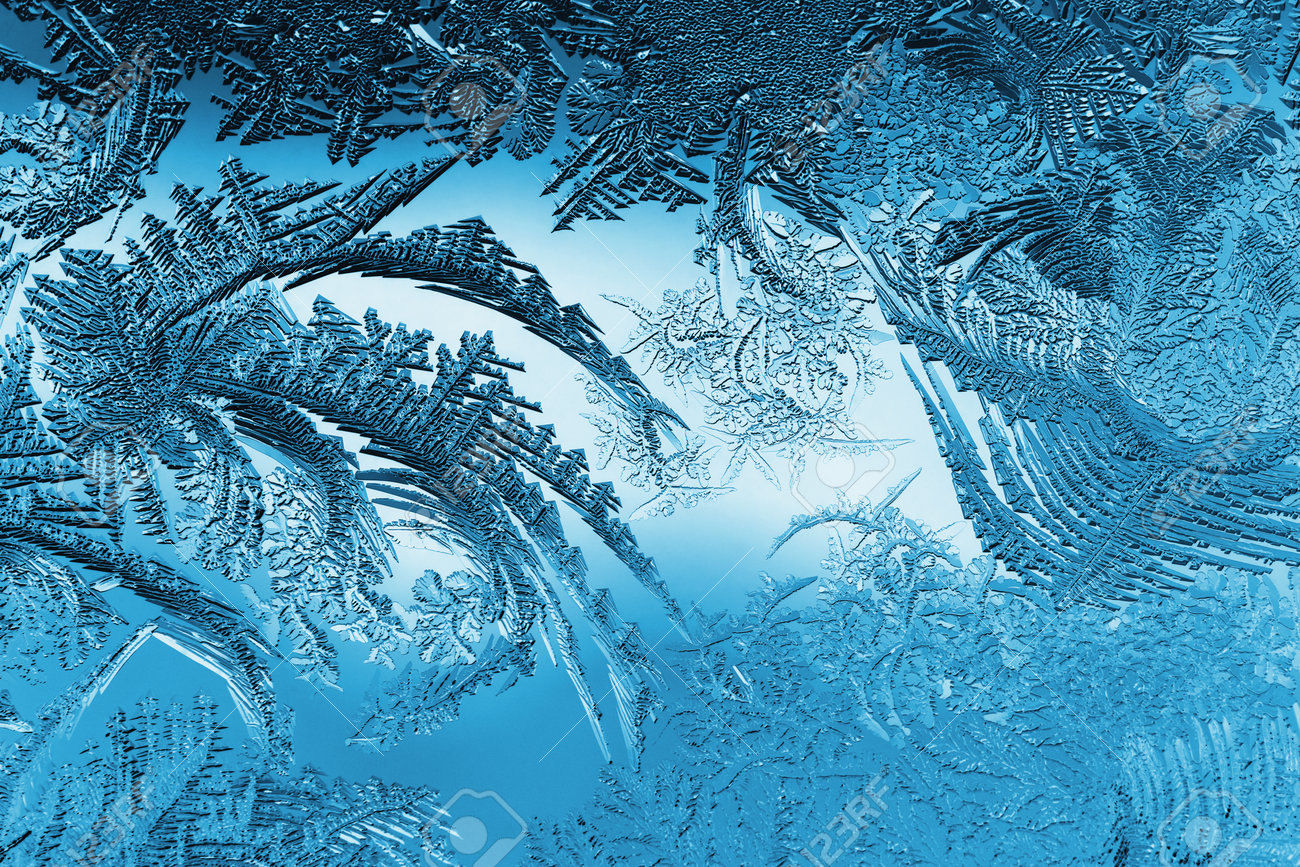Abstract Christmas Background. Blue Tinted Wallpaper. Ice Crystals On Frozen  Window Glass. Frost Drawing. Winter Season Patterns. Frostwork And Frosting  Pattern. Cold And Crystal. Macro Stock Photo, Picture and Royalty Free  Image.