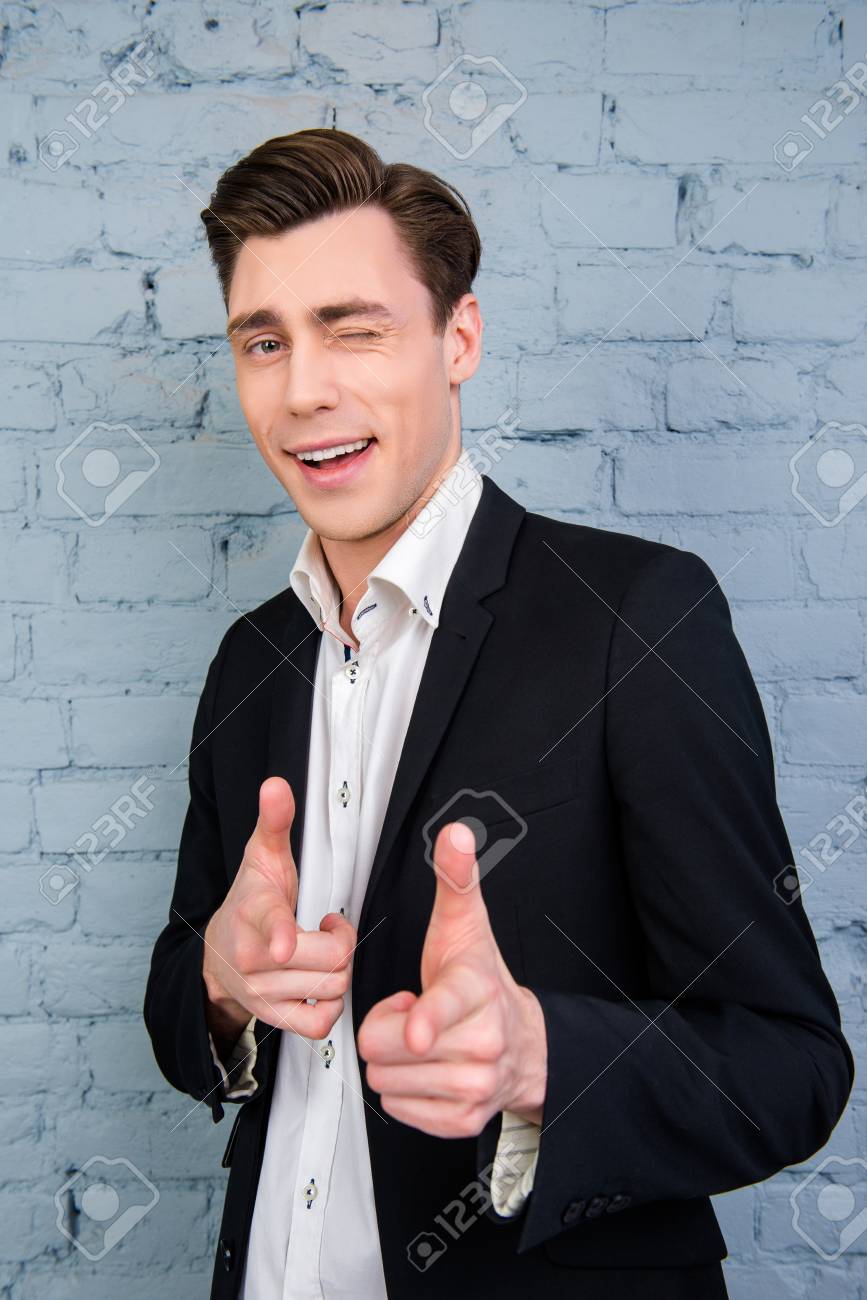 Portrait Of Handsome Young Businessman Winking And Pointing On Camera Stock  Photo, Picture and Royalty Free Image. Image 56650008., image size:867x1300