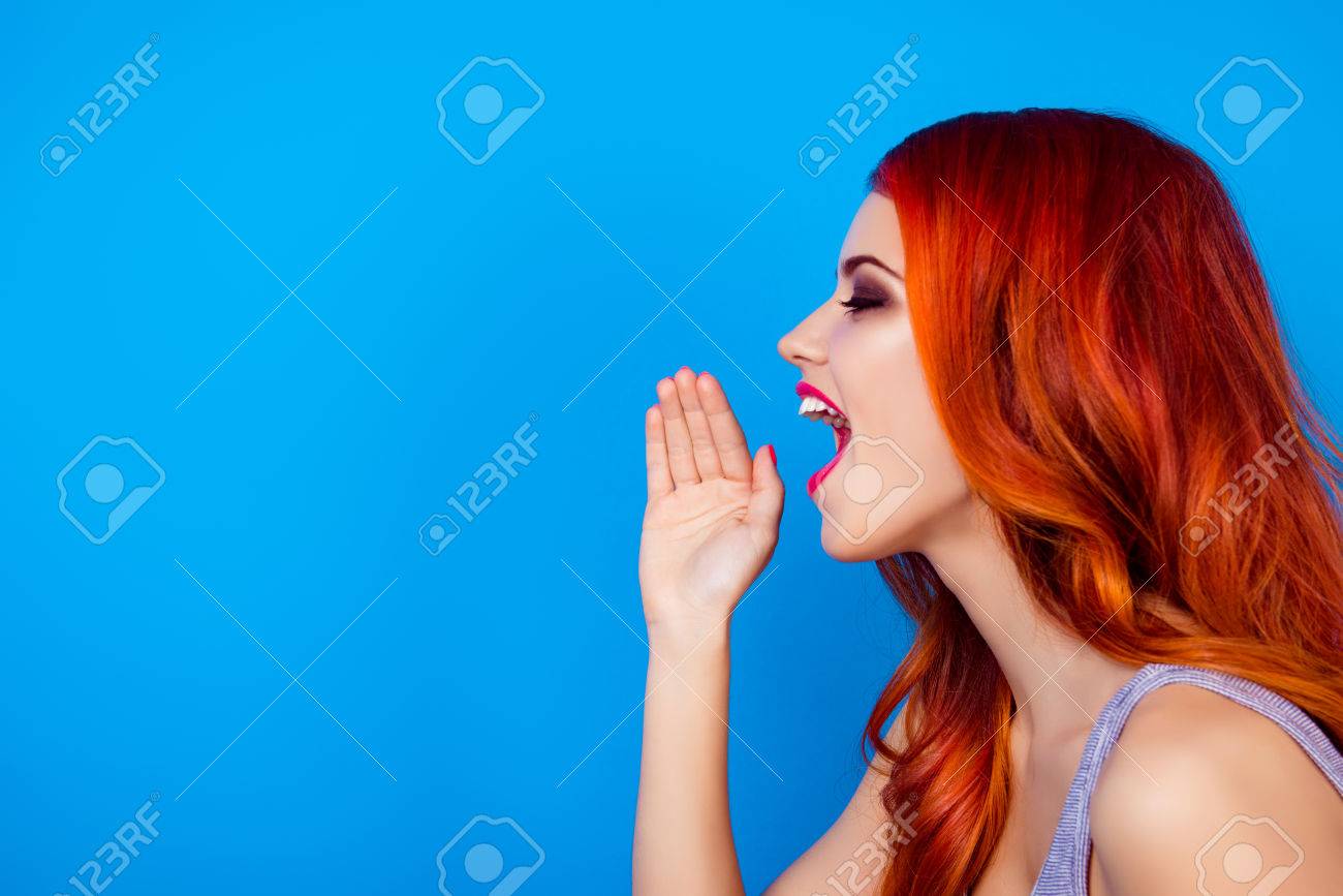 Side View Photo Of Attractive Pretty Girl Tell The News While Open Mouth  And Holding Hands Near Lips While Standing On Blue Background Stock Photo,  Picture And Royalty Free Image. Image 80778628.