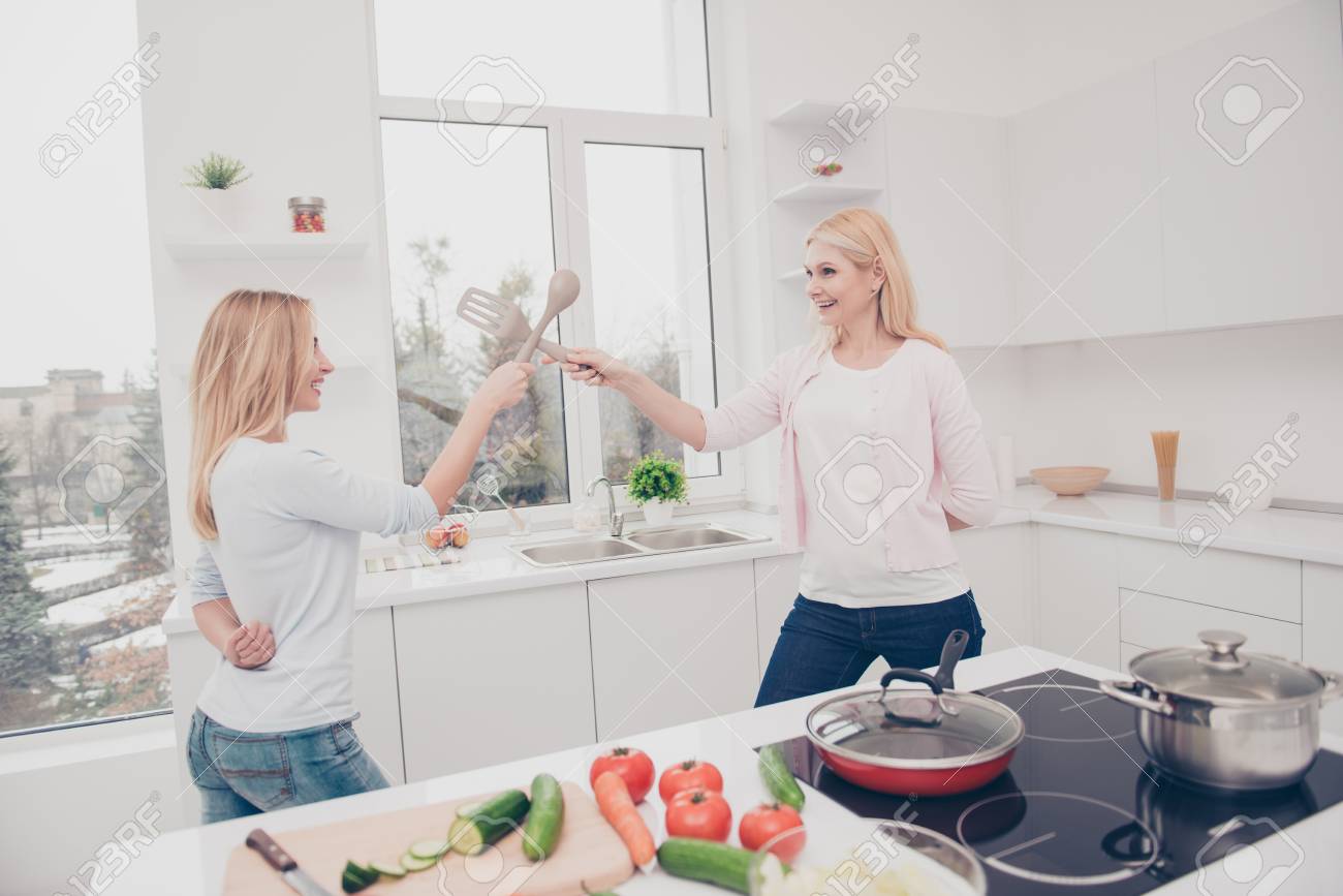 Funny Foolish Playful Crazy Mother And Daughter Dueling With