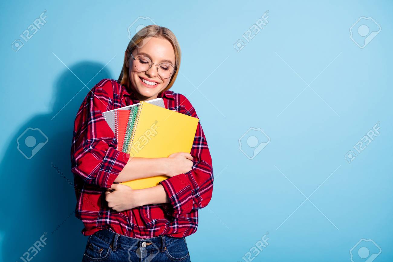 Portrait of her she nice charming cute attractive cheerful teen girl wearing checked shirt hugging holding in hands copy-book isolated over teal turquoise bright vivid shine background - 120892785 Portrait of her she nice charming cute attractive cheerful teen girl wearing checked shirt hugging holding in hands copy-book isolated over teal turquoise bright vivid shine background - 120892785