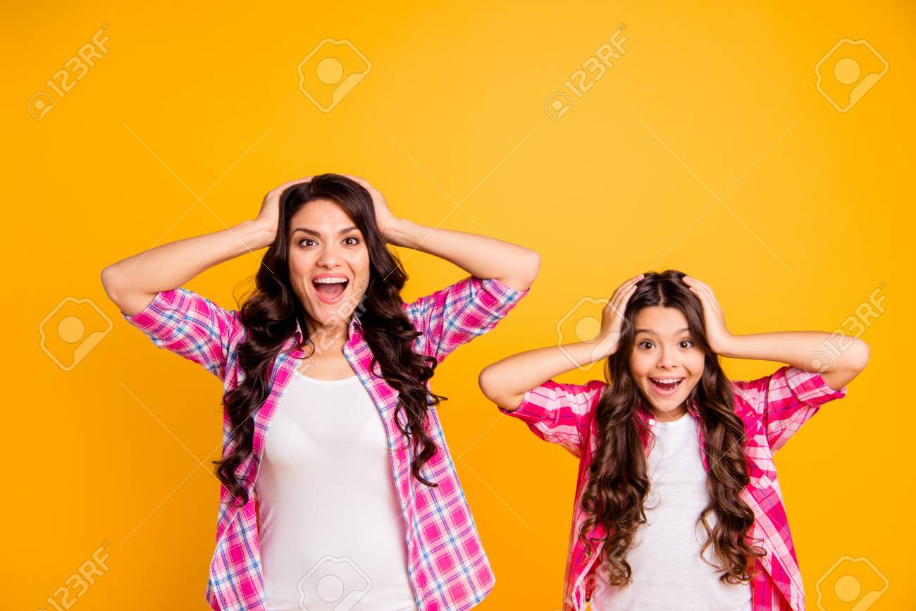 Portrait of charming hispanic mom little kid pink clothing astonished sales discount news impressed isolated satisfied rejoice scream shout touch head hairstyle hairdo vibrant background - 120896426 Portrait of charming hispanic mom little kid pink clothing astonished sales discount news impressed isolated satisfied rejoice scream shout touch head hairstyle hairdo vibrant background - 120896426
