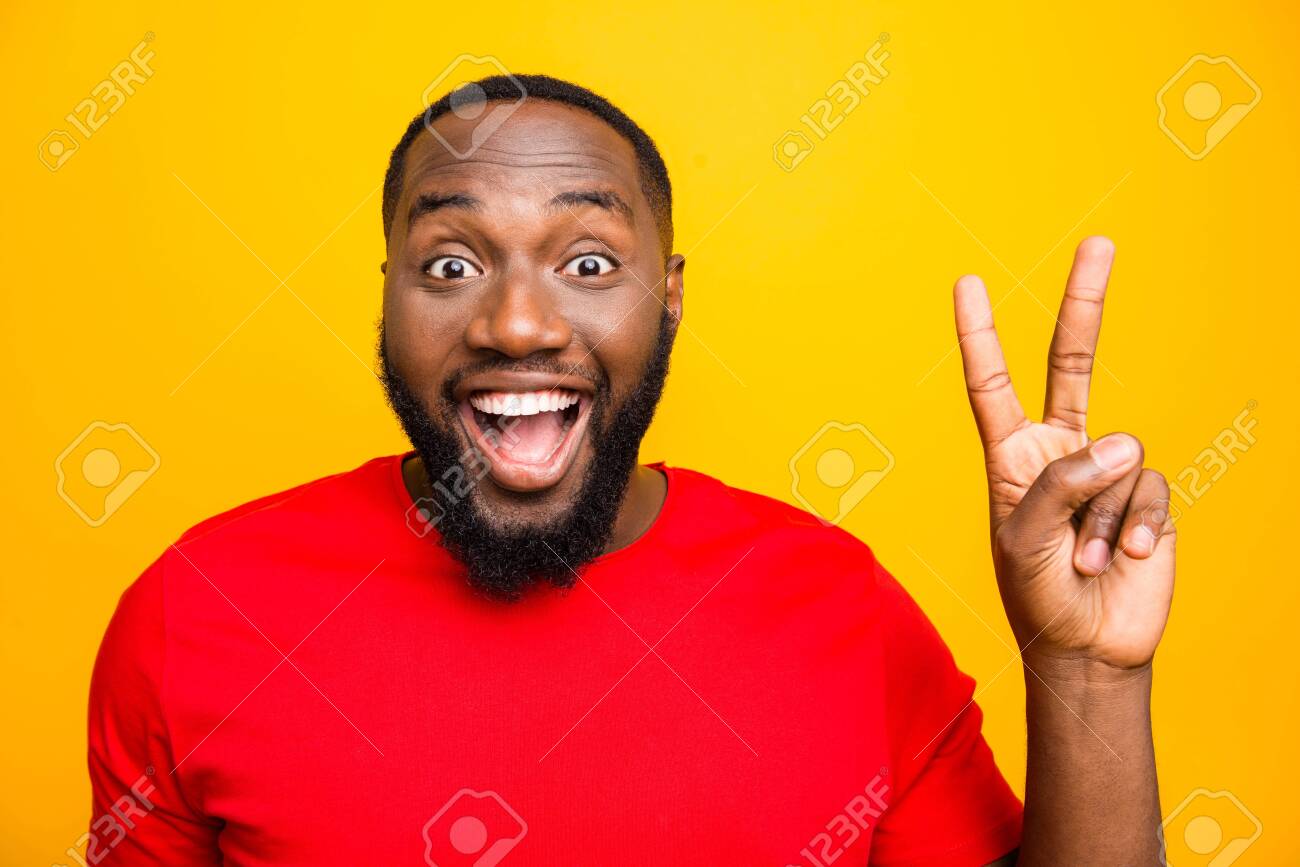 Close Up Photo Of Black Man Rejoicing Enjoying Showing You V Sign Saying Hi While Isolated With Yellow Background Stock Photo Picture And Royalty Free Image Image 129185697