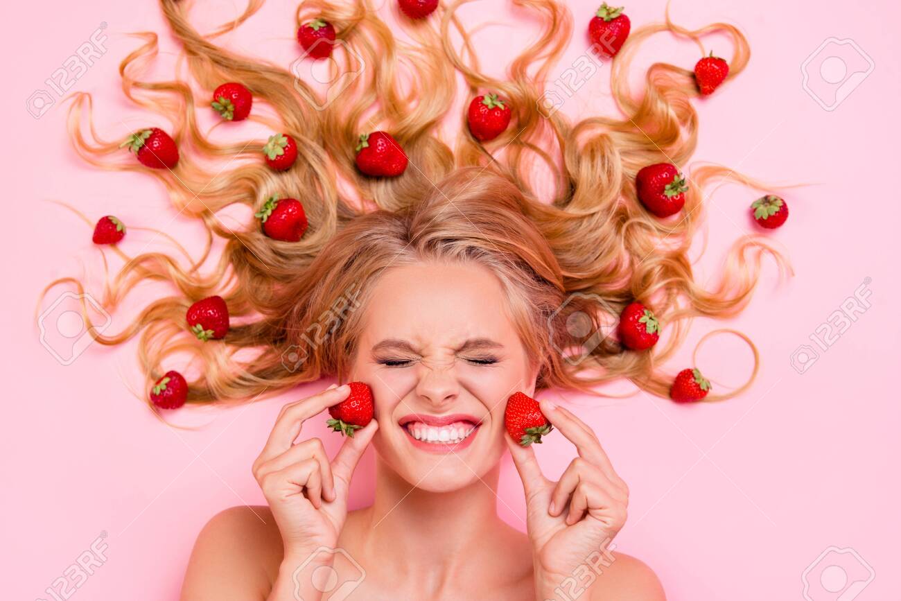 Close up top above high angle view photo beautiful she her lady lying down among fruit strawberries long hair strong action of facial fruit scrub mask cream moisturizer lotion isolated pink background - 130344031 Close up top above high angle view photo beautiful she her lady lying down among fruit strawberries long hair strong action of facial fruit scrub mask cream moisturizer lotion isolated pink background - 130344031