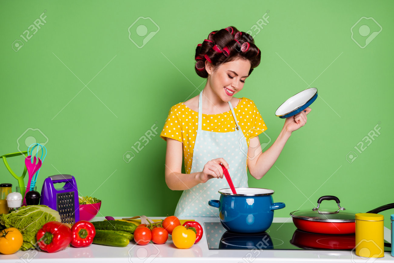 Cheerful Focused Housewife Cooking