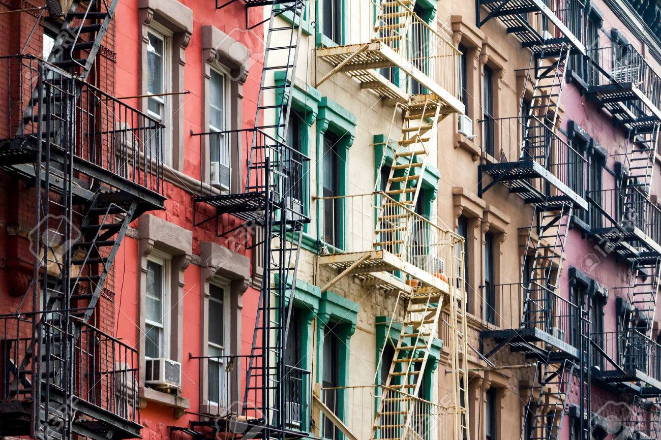 nyc block of rainbow colored apartment buildings in manhattan