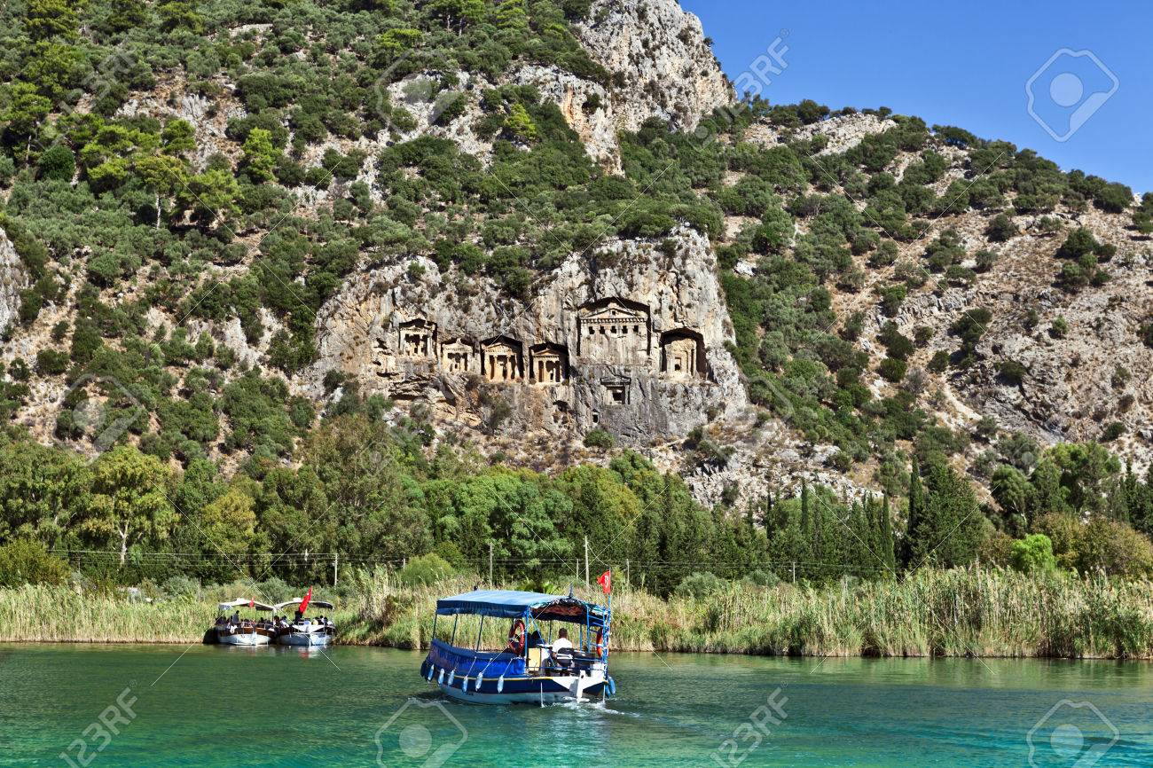 Tourist boats by the historic Kaunian rock tombs in Dalyan, Ortaca, TURKEY. - 32571372 Tourist boats by the historic Kaunian rock tombs in Dalyan, Ortaca, TURKEY. - 32571372