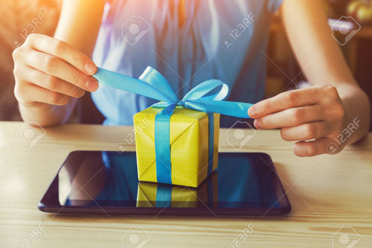 hands with gift box and digital tablet. online shopping concept - 64921011 hands with gift box and digital tablet. online shopping concept - 64921011