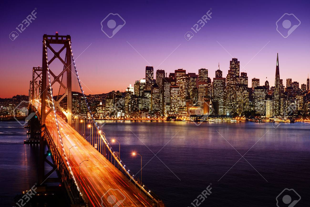 San Francisco skyline and Bay Bridge at sunset, California - 26115786 San Francisco skyline and Bay Bridge at sunset, California - 26115786